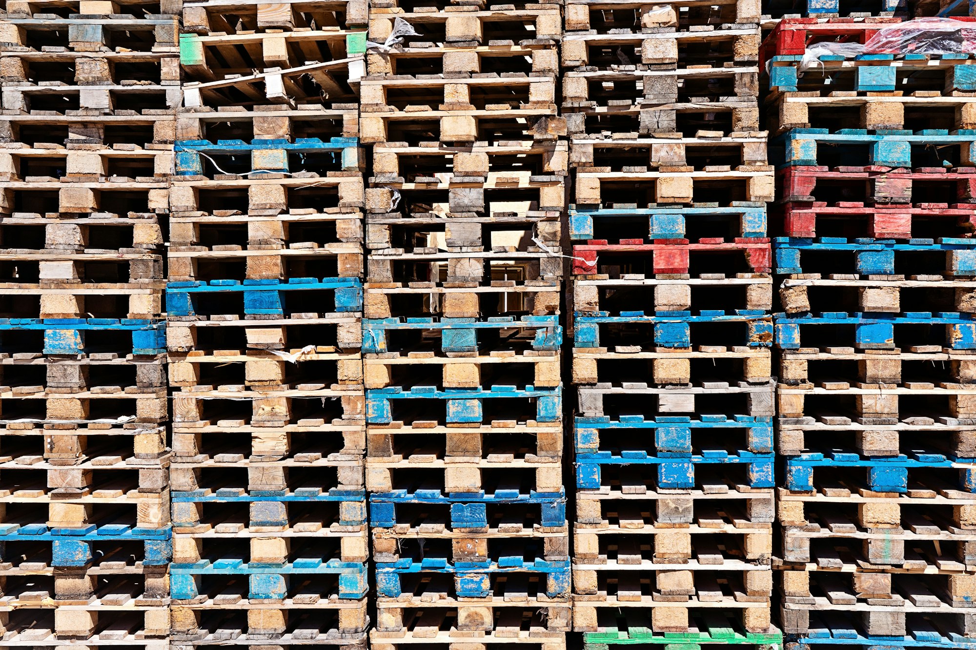 Abstract wooden pallets surface background, stack of pallet in warehouse, close up